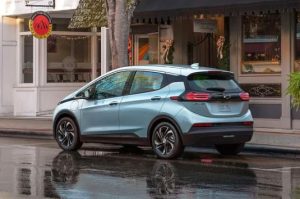 A photo of a 2023 Chevy Bolt EV parked on a city street near Anderson, Indiana.