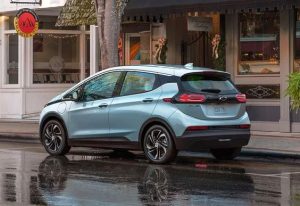 A blue 2023 Chevy Bolt parked on the side of a street near Anderson, Indiana.