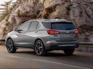 A 2024 Chevrolet Equinox driving down a road near a mountain near Anderson, Indiana