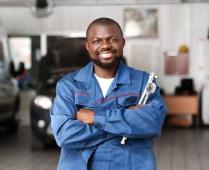 A service technician posing for a photo in a service center near Anderson, Indiana