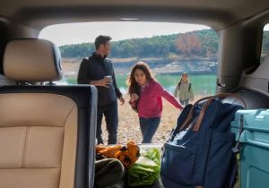 An interior view of a 2024 Chevy Equinox, looking out the back hatch at a family. Taken near Anderson, IN