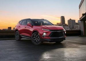 A red 2024 Chevy Blazer parked on concrete outdoors near Anderson, Indiana
