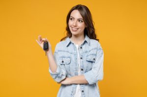 A person holding a set of car keys after buying a car near Anderson, Indiana