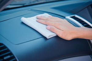A person cleaning the interior of their car near Anderson, Indiana