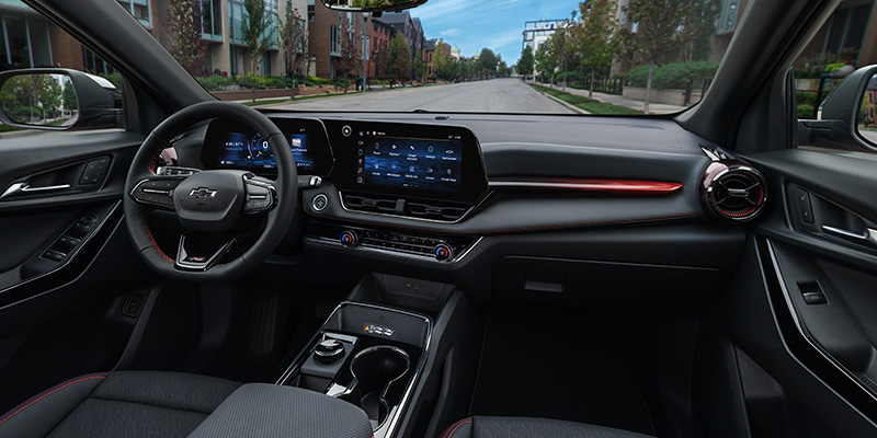 Interior view of a Chevrolet vehicle showcasing the dashboard, steering wheel, and infotainment system.