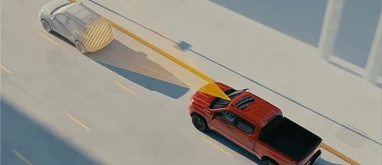 Overhead view of a red Chevrolet pickup with an illustrated detection beam reaching a vehicle ahead