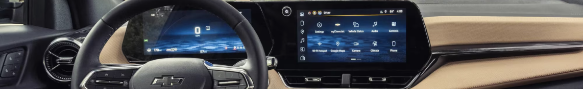 A Chevrolet dashboard with a digital instrument cluster and a center touchscreen showing app icons including Google Maps