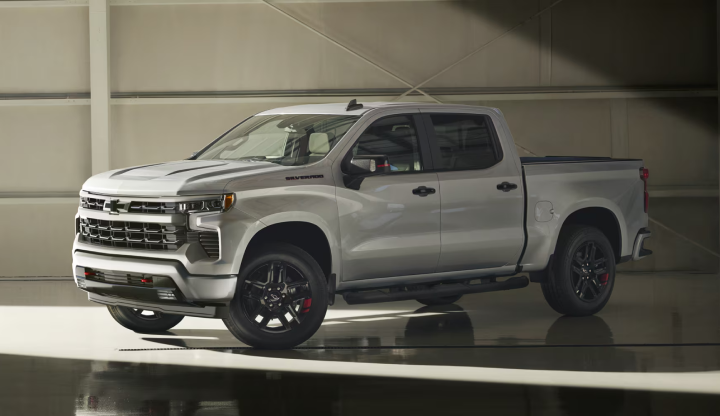 A silver Chevrolet Silverado 1500 Crew Cab parked in a concrete portico