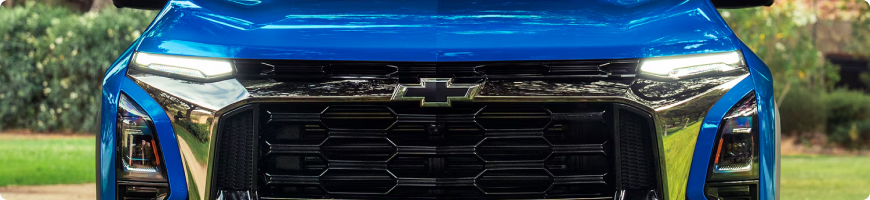 Close-up of the grille and Chevrolet emblem on a blue 2027 Chevrolet Equinox